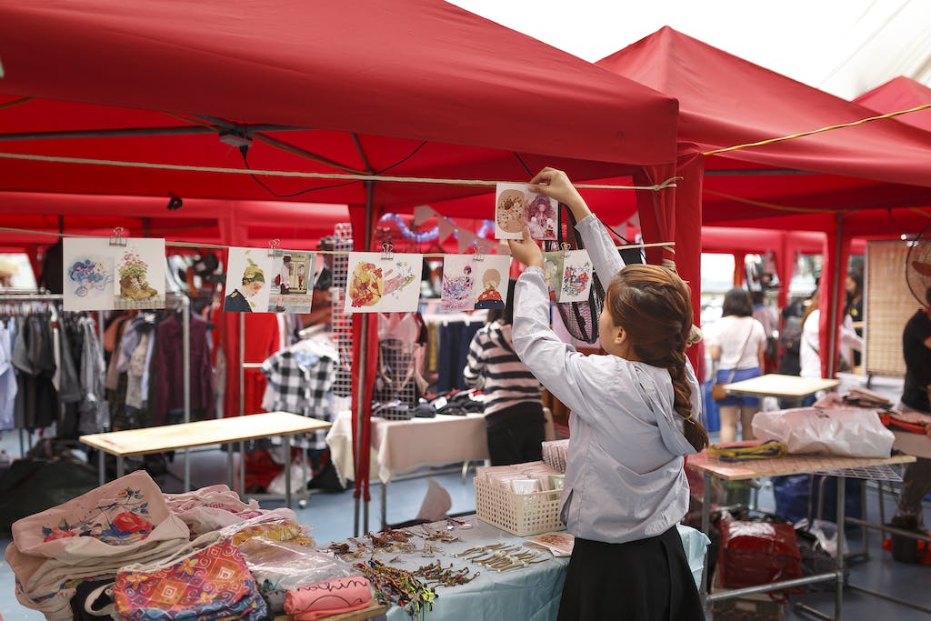 Girl Arranging Displays For Sale